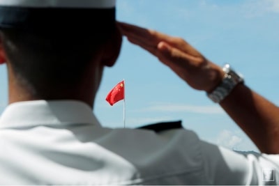 soldier saluting Chinese flag
