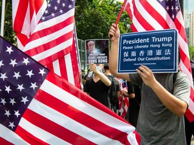 Protests in Hong Kong routinely carry the US flag and photos of Donald Trump