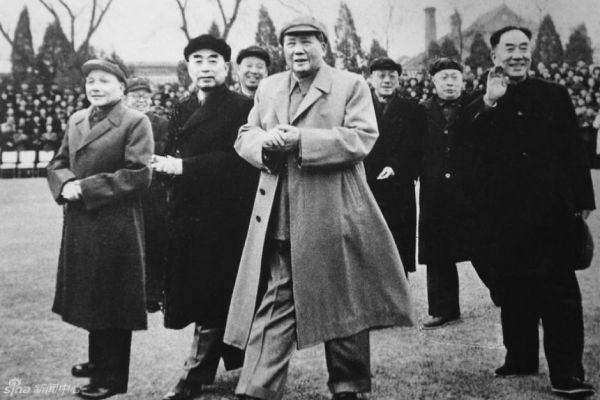 Deng Xiaoping; to his left is Zhou Enlai and center stage is Mao Zedong.