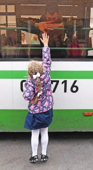 Russian girl waving goodbye
