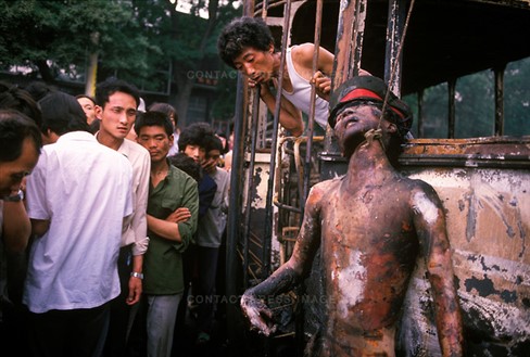 Tiananmen PLA soldier burned hanging from bus voltaire.net 488 x 329