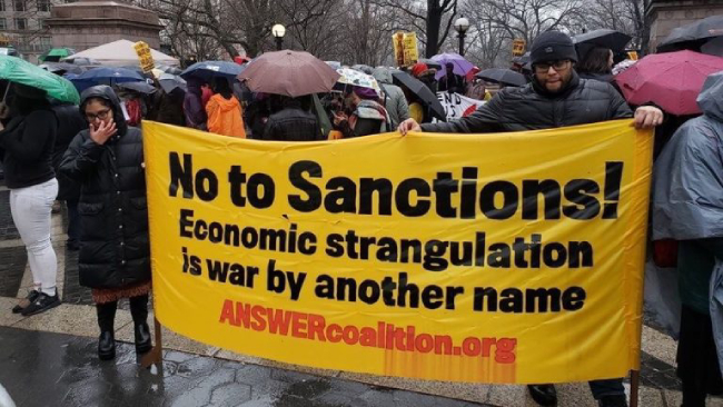 "No to sanctions" street protest sign
