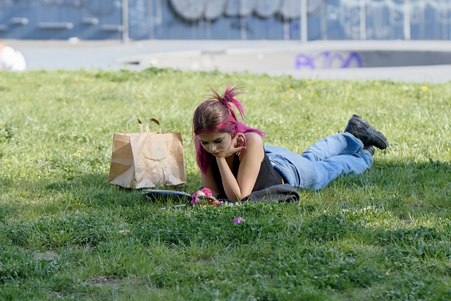 woman reading in grass